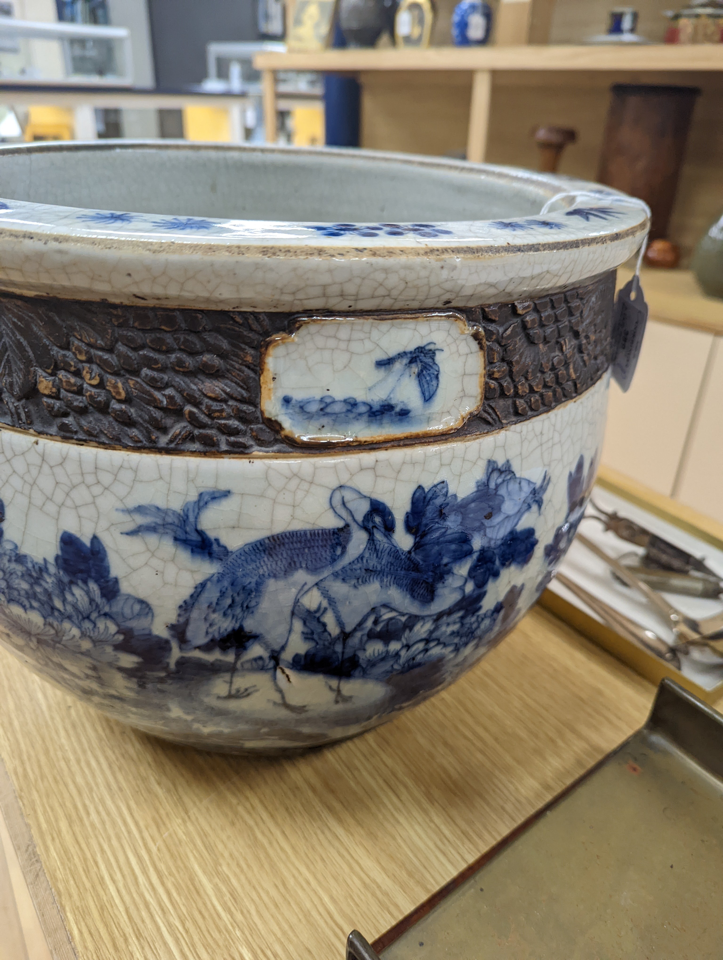 A late 19th/early 20th century Chinese blue and white crackleglaze jardiniere 30cm